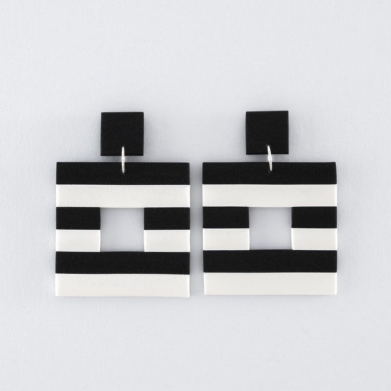 Black & White N°4 handmade dangle earrings – Hollow square, black and white striped earrings with 925 sterling silver findings on light grey background.
