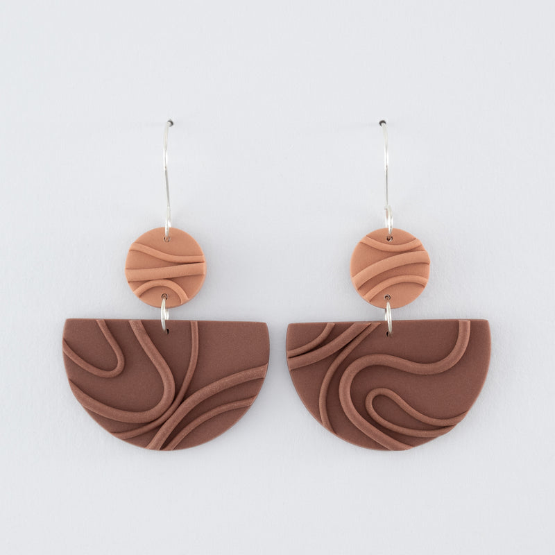 Mocha Mousse N°3 handmade dangle earrings – creamy brown geometric shapes with playful wavy textures and 925 sterling silver findings on light grey background.