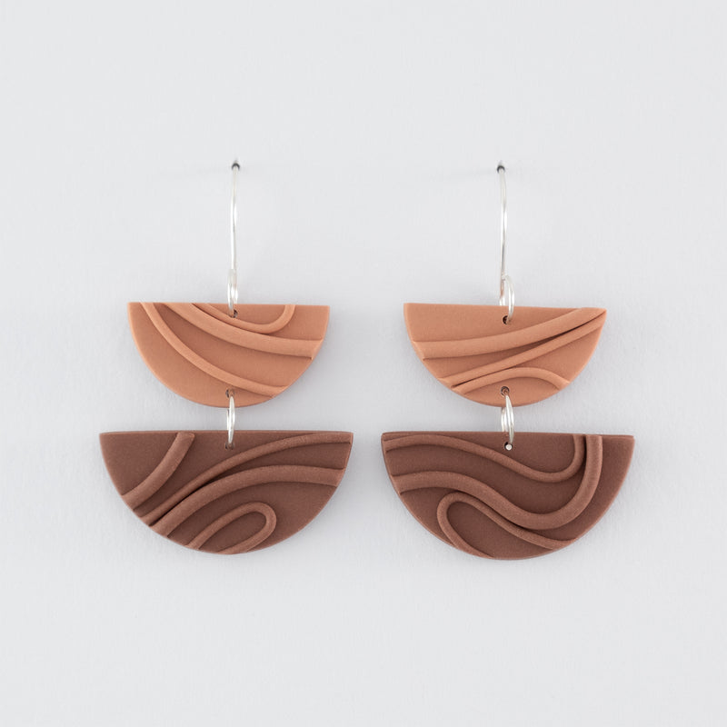 Mocha Mousse handmade dangle earrings – creamy brown, double half-circle shapes, with playful wavy textures and 925 sterling silver findings on light grey background.