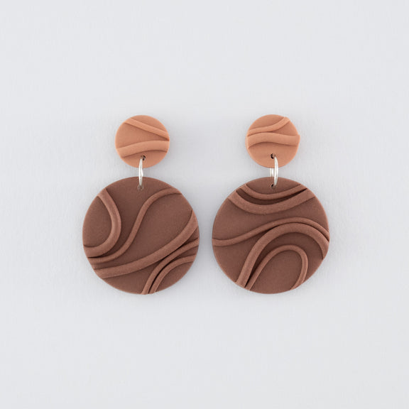 Mocha Mousse N°2 handmade dangle earrings – creamy brown round circular shapes with playful wavy textures and 925 sterling silver findings on light grey background.