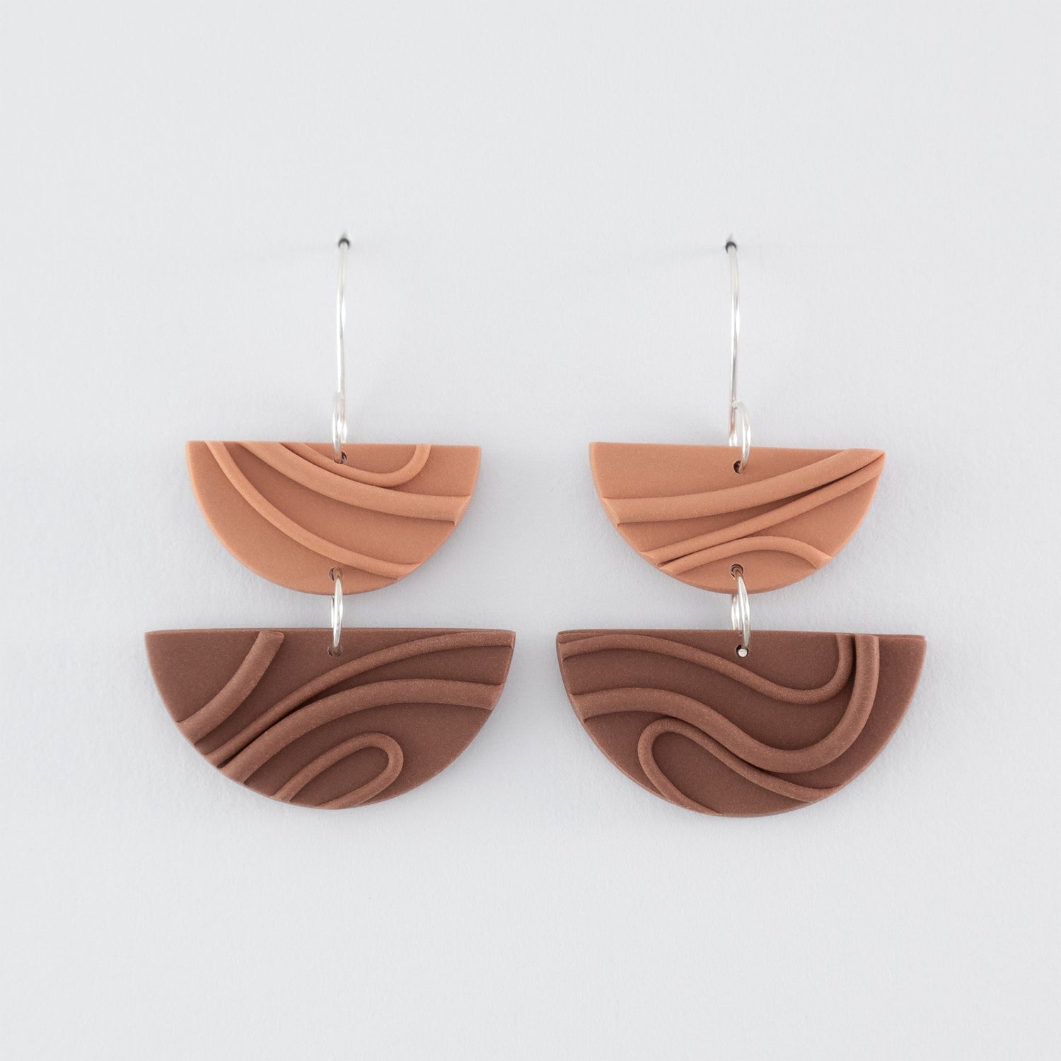 Mocha Mousse handmade dangle earrings – creamy brown, double half-circle shapes, with playful wavy textures and 925 sterling silver findings on light grey background.